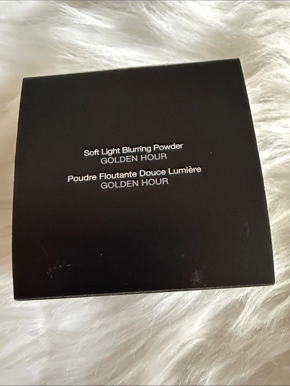 BECCA Soft Light Blurring Powder in Golden Hour - Black Compact Box